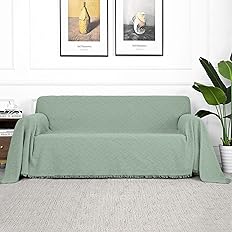 Stylish green couch cover with soft fabric for modern living room decor.
