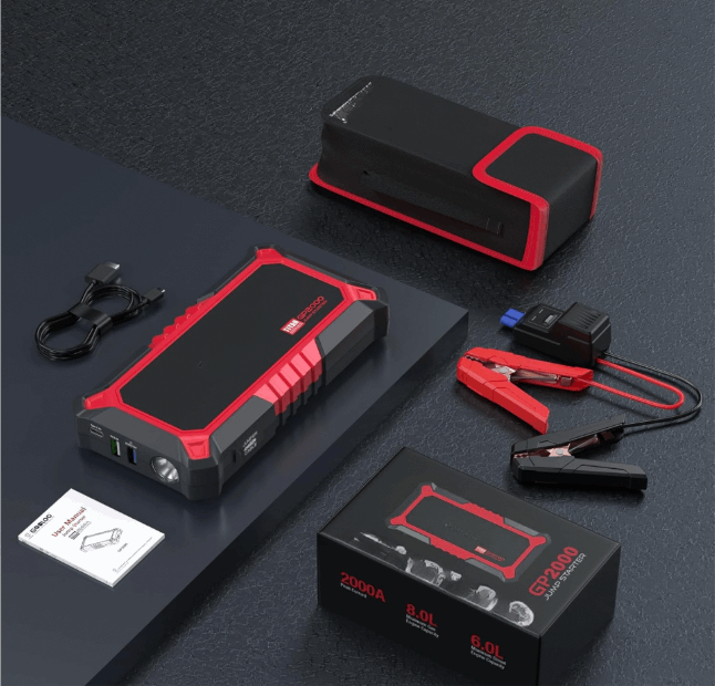 Red and black portable jump starter with heavy-duty jumper cables