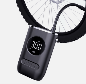 Compact cordless air pump with neck strap and digital LCD screen.