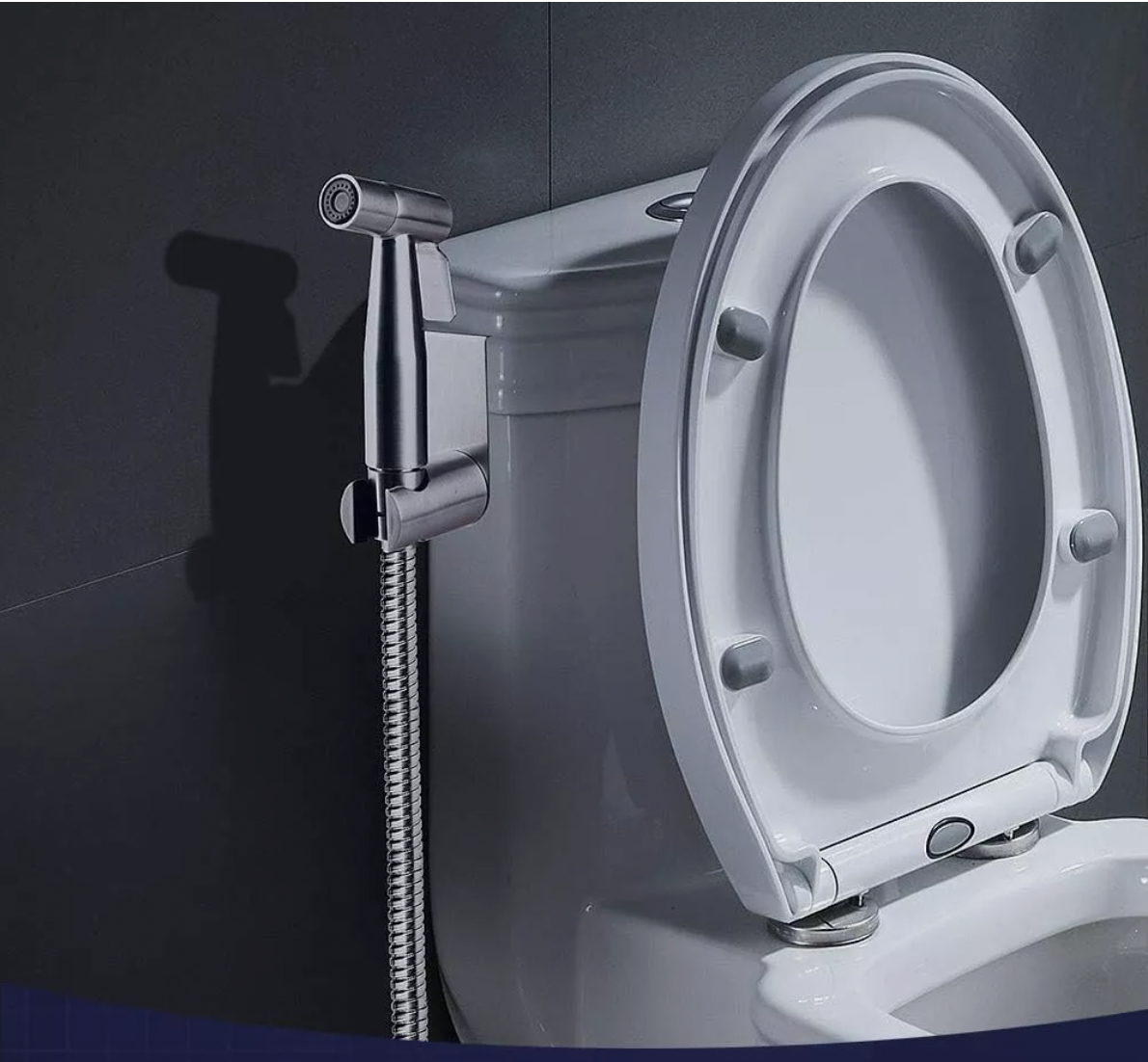 Stainless steel bidet spray mounted beside toilet for personal hygiene cleaning