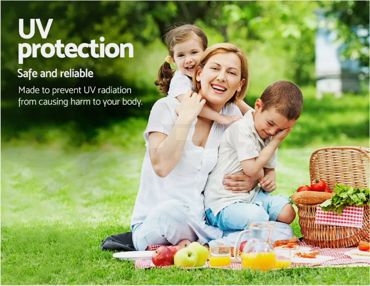 Family camping with privacy shower tent in the background