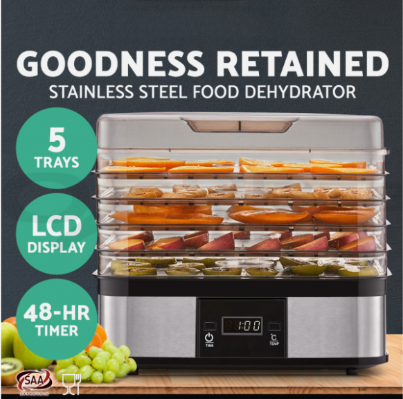 Electric food dehydrator preserving fruit slices with adjustable temperature settings.
