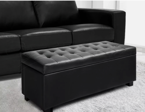 Black ottoman storage box with cushioned lid for living room