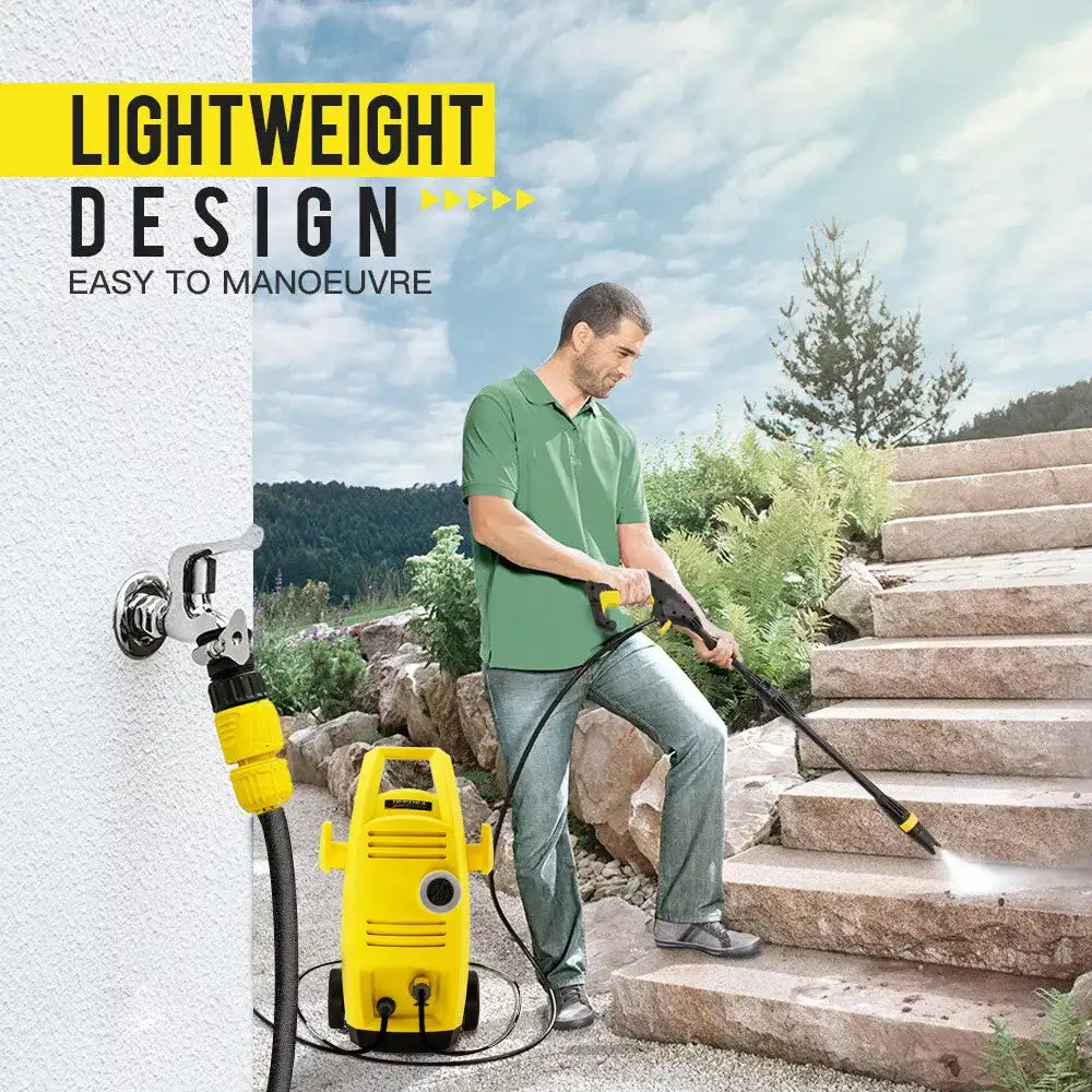 Powerful pressure washer being used for cleaning car exterior and wheels.