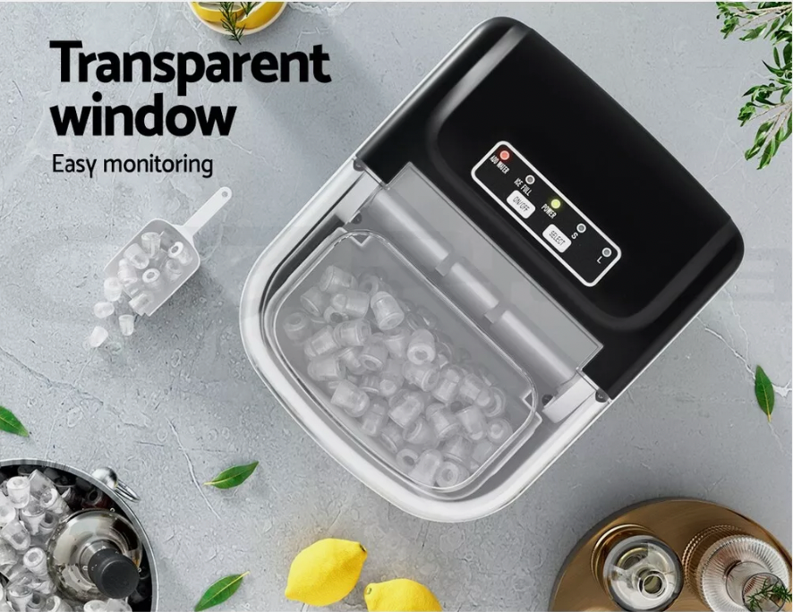 Compact ice maker showing removable ice basket and scoop for easy use.